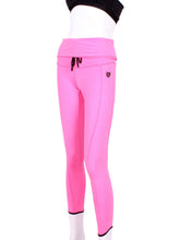 Load image into Gallery viewer, This is our limited edition rolled/high waist leggings in Pink.  This piece has a silky soft and quick-drying.  We make these in very small quantities - by design.  Unique.  Luxurious.  Comfortable.  Cool.  Fun.
